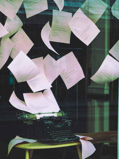 Typewriter and sheets of paper